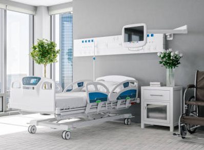 Interior of a modern luxury hospital room with city view.